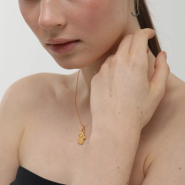 Amulet Pendant | 24k gold pendant on a model