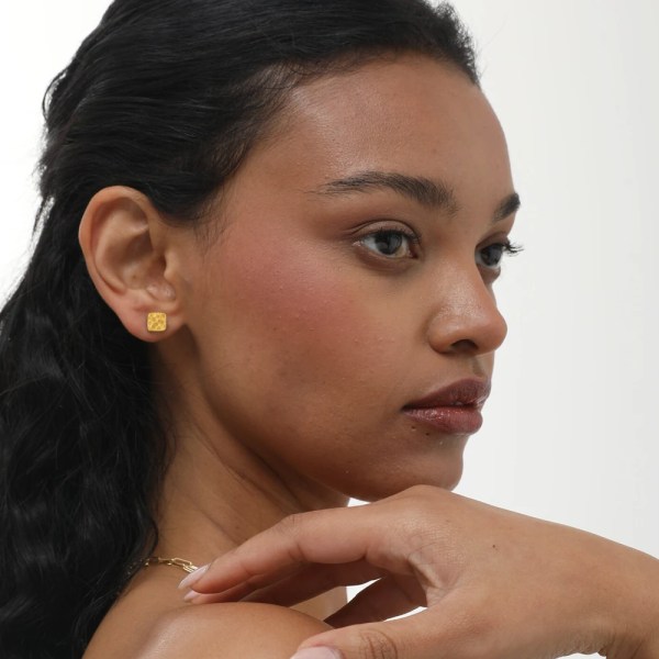 Lira Earring | 24k gold earrings on a model