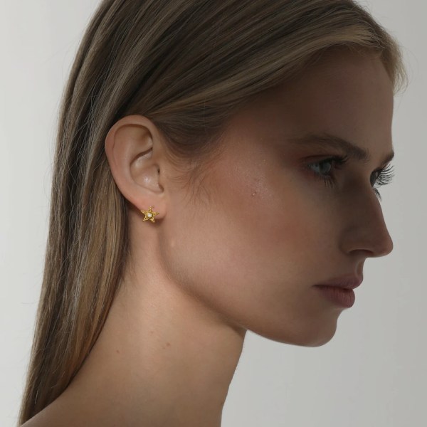 Star Earring | 24k gold earrings on a model