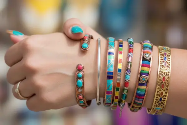 What factors affect the adjustability of a gold cuff bracelet?
